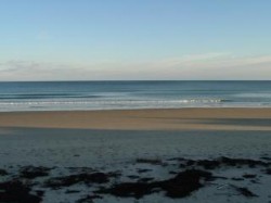 Beach in front of cottage at low tide