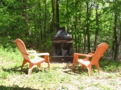 Outdoor fireplace visible from hot tub